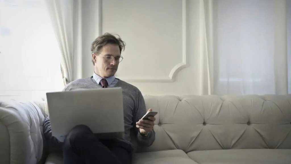 a man holding a leptop