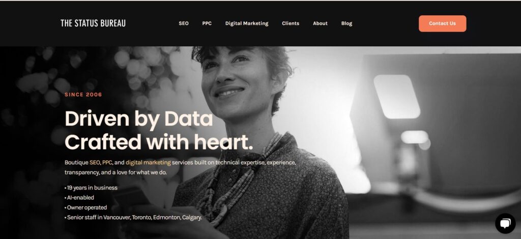 The Status Bureau homepage featuring a black-and-white image of a smiling woman with the tagline “Driven by Data, Crafted with Heart,” emphasizing boutique SEO and digital marketing.