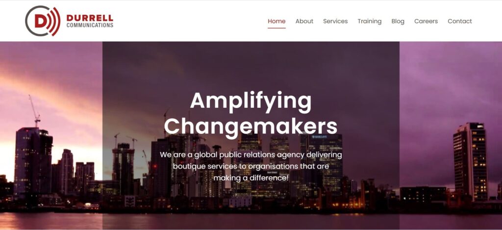 Durrell Communications homepage with a skyline at dusk, emphasizing its mission of amplifying changemakers through boutique public relations services.
