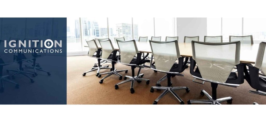 Office-themed banner of Ignition Communications featuring a modern conference room setup, reflecting corporate PR services and professional communications strategies.