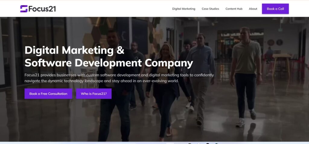 Homepage of Focus21 showing a team walking in a modern office, with the headline “Digital Marketing & Software Development Company.”