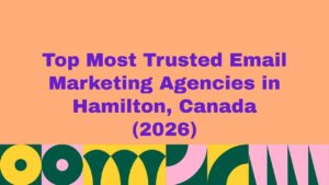 Featured banner image displaying the text “Top Most Trusted Email Marketing Agencies in Hamilton, Canada (2026)” on a peach background with bold purple typography and colorful abstract geometric patterns along the bottom, representing a trusted guide to leading email marketing agencies in Hamilton, Canada.