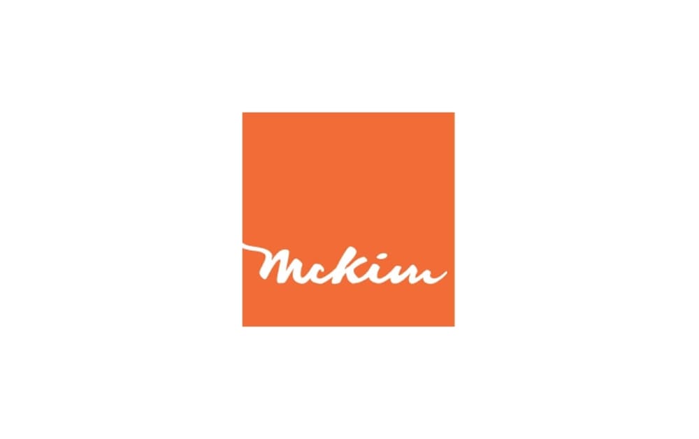 Simple orange square with the handwritten-style white text “McKim” across it, giving a clean and professional appearance.