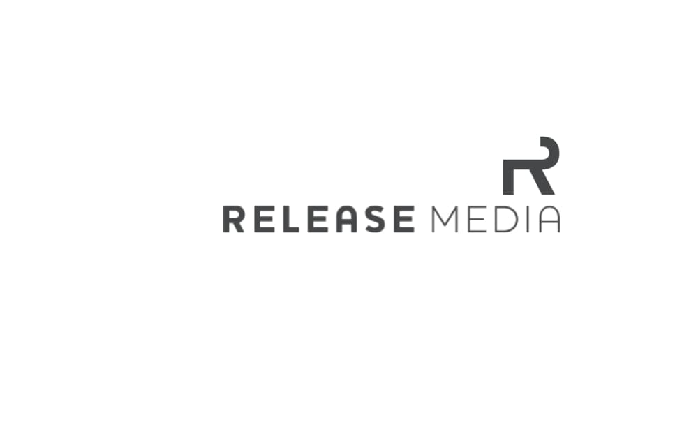 Minimalist logo with “RELEASE MEDIA” in gray uppercase letters and a modern, abstract “R” icon to the right.