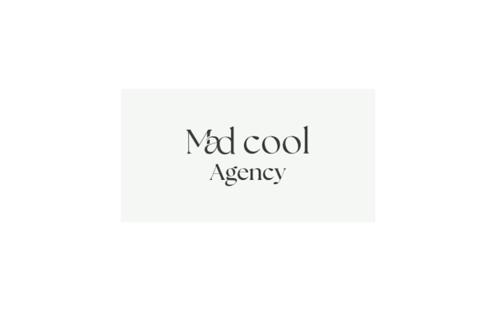Minimalist logo of Mad Cool Agency with elegant black text on a white background, representing a creative branding and marketing firm known for modern design aesthetics.