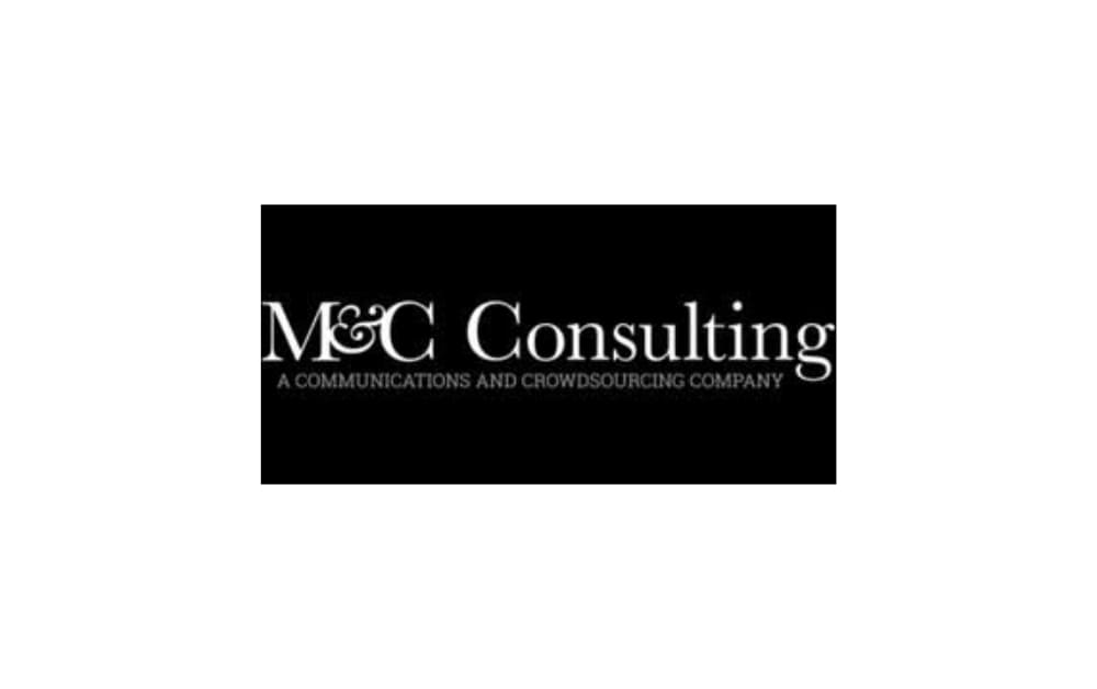 Black-and-white logo for M&C Consulting with serif font and the tagline “A Communications and Crowdsourcing Company,” suggesting a high-level strategic and PR service provider.