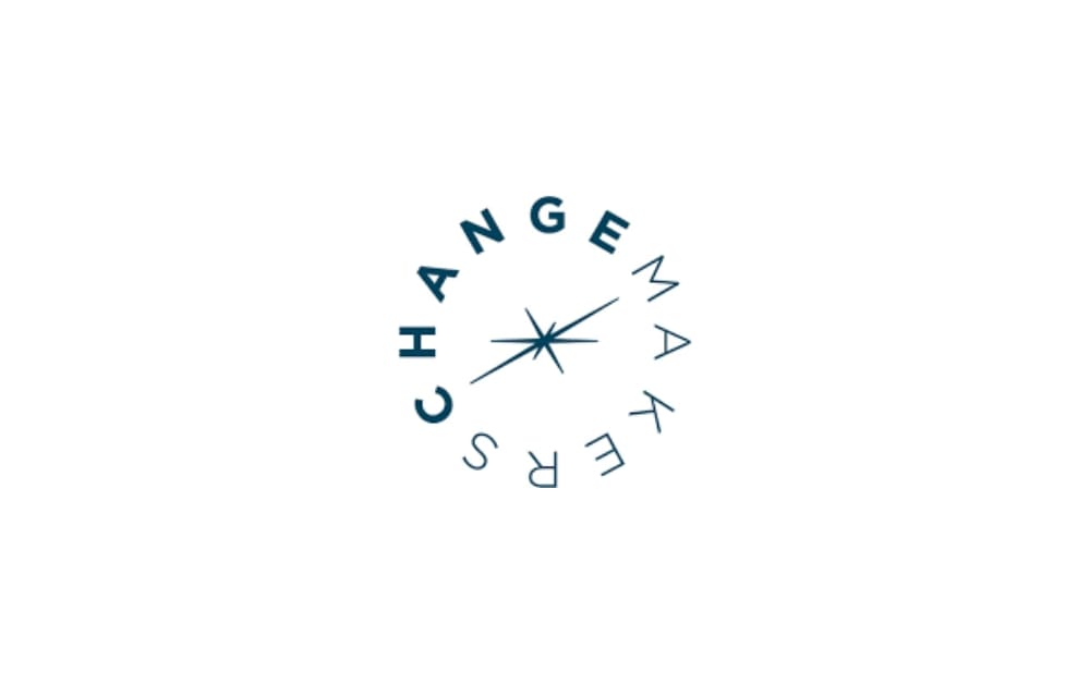 Circular logo for ChangeMakers with the word “CHANGEMAKERS” arranged around a starburst symbol in the center, representing strategic communication and branding.