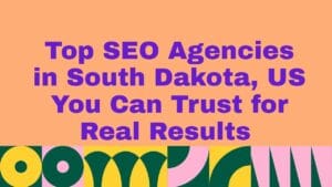 Graphic with a peach background and bold purple text reading ‘Top SEO Agencies in South Dakota, US You Can Trust for Real Results.’ A colorful geometric border with shapes in green, yellow, and pink runs along the bottom.